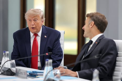 Trump and Macron speaking at a meeting.