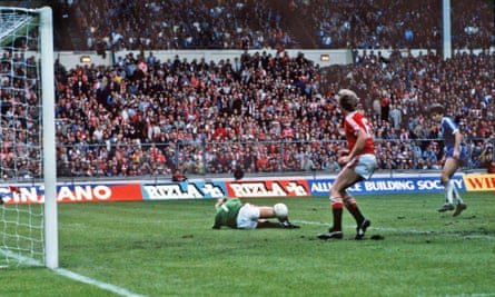 Gordon Smith has a shot saved by Gary Bailey in the last minute of the final.