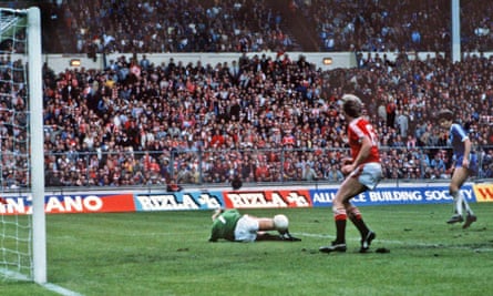 Brighton’s Gordon Smith (far right) is foiled by the Manchester United goalkeeper, Gary Bailey, in the last moments of extra time during the first final.