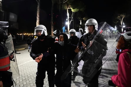 Police detain a protester during an anti-government rally in Tirana on Sunday.