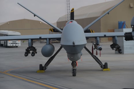 A US air force MQ-9 Reaper drone sits on the tarmac at an air base.