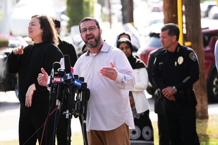 Taha Hassane, Iman for the Islamic Center of San Diego, speaks near the scene of a shooting on Monday.