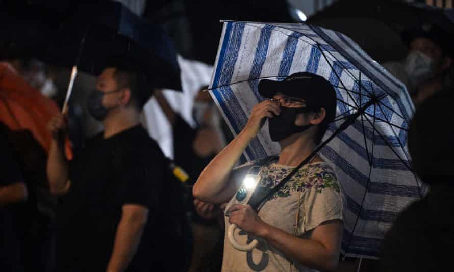 Supporters gather outside the Apple Daily offices on Wednesday