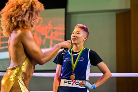 Sze Sze Rowlinson speaks to the host in the ring after her WGBC fight in 2023