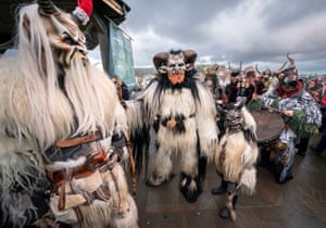 Whitby, UK: People take part in the Krampus Run, a street parade that celebrates the horned creature that accompanies Saint Nicholas on his rounds