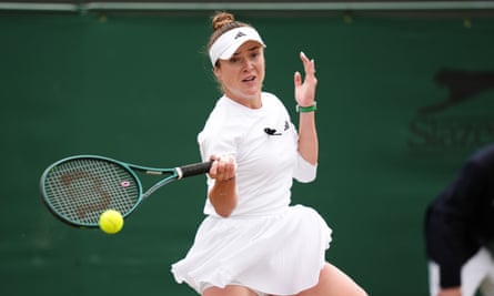 Elina Svitolina wears a black ribbon in solidarity with the victims of the Russian bombing of a children’s hospital in Kyiv during her victory over Xinyu Wang