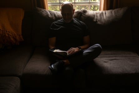 Castleberry reads from the Bible on a recent afternoon at his home in Mobile, Alabama.