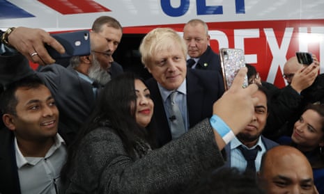 Boris Johnson posing for pictures at his battlebus launch.