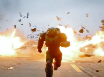 Heavily armoured figure running from an explosion on an airfield.