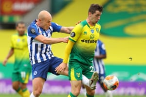 Brighton’s Aaron Mooy (left) vies with Norwich’s Kenny McLean.