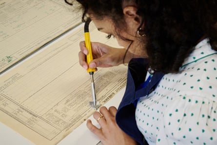 A National Archives of Ireland worker conserves a page from the 1926 census.