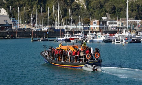 A group of people thought to be migrants are brought to Dover, Kent, after a small boat incident in the Channel