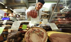 A Marks & Spencer puts a price on a joint of ham.