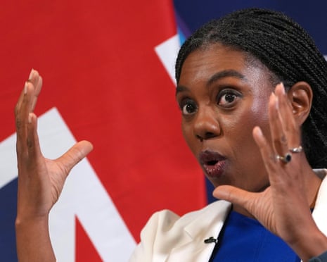 Kemi Badenoch speaking in front of a union jack
