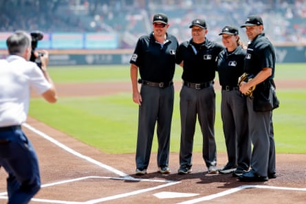 Jen Pawol, second from right, poses with fellow umpires David Rackley, Chris Guccione and Chad Whitson before the first pitch of Saturday’s double-header in Atlanta.