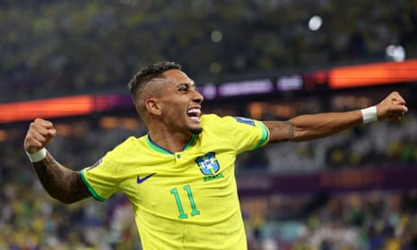 Raphinha of Brazil celebrates the team's first goal scored by Vinicius Junior.