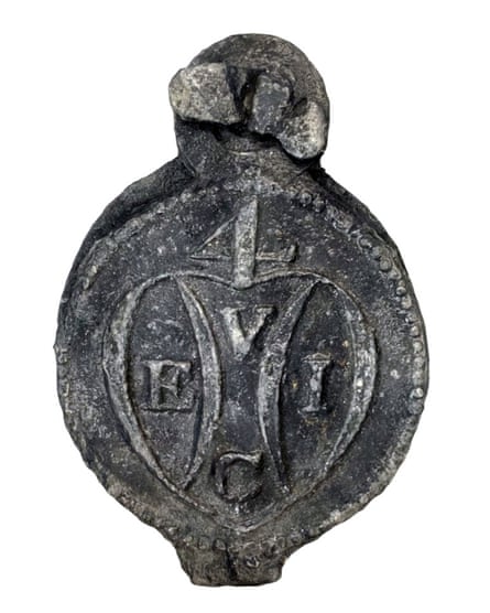 A lead cloth seal from the wreck of the Earl of Abergavenny with the East India Company logo.