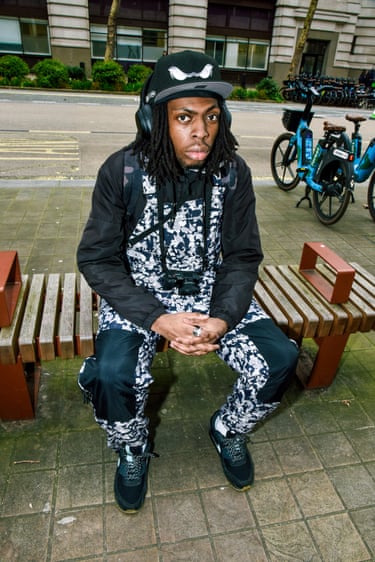 A person wearing a multicoloured jumpsuit