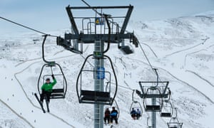 Skiers and snowboarders at Glenshee Ski Centre.