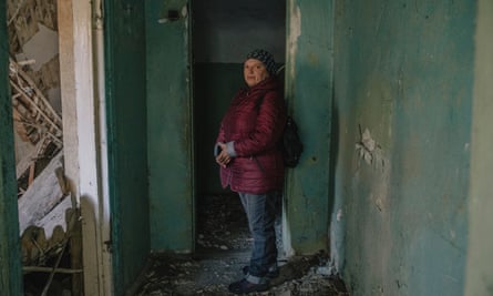 Ksenia Lukyanova, picture in the ruins of her home in the village of Hrushivka