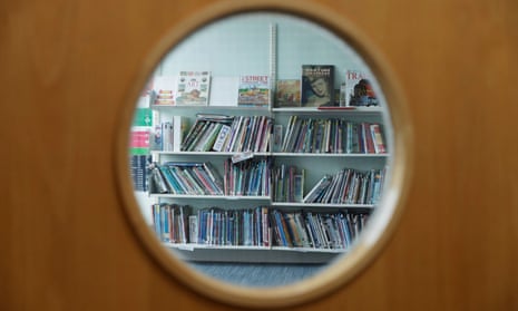 Books through the window of a closed school library