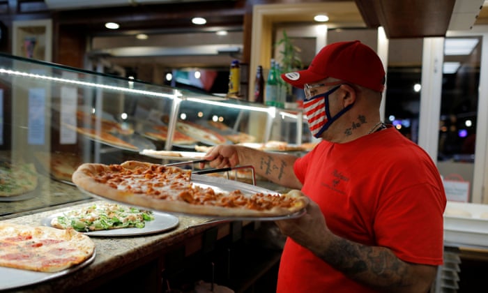 Sal Finocchiaro prepares pizza at Palermo Pizzeria and Restaurant, which he co-owns, on Staten Island in New York.