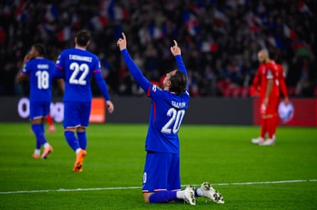 Florian Thauvin points his fingers to the sky during the European qualifying match between France and Azerbaijan