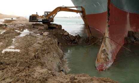 Salvage efforts have included digging under the Ever Given where it is wedged onto the Suez canal’s banks. 