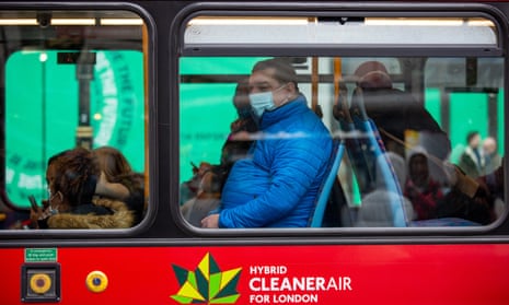 A passenger wearing a face mask in a bus  in London