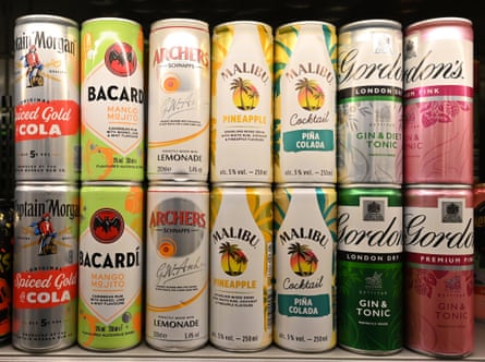 Rows of canned cocktails in a fridge