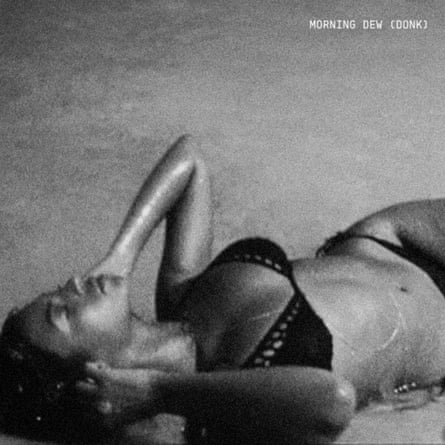 Black-and-white music-release cover art featuring a photo of Beyoncé lying on her back in a studded bikini with her hands held to her ears