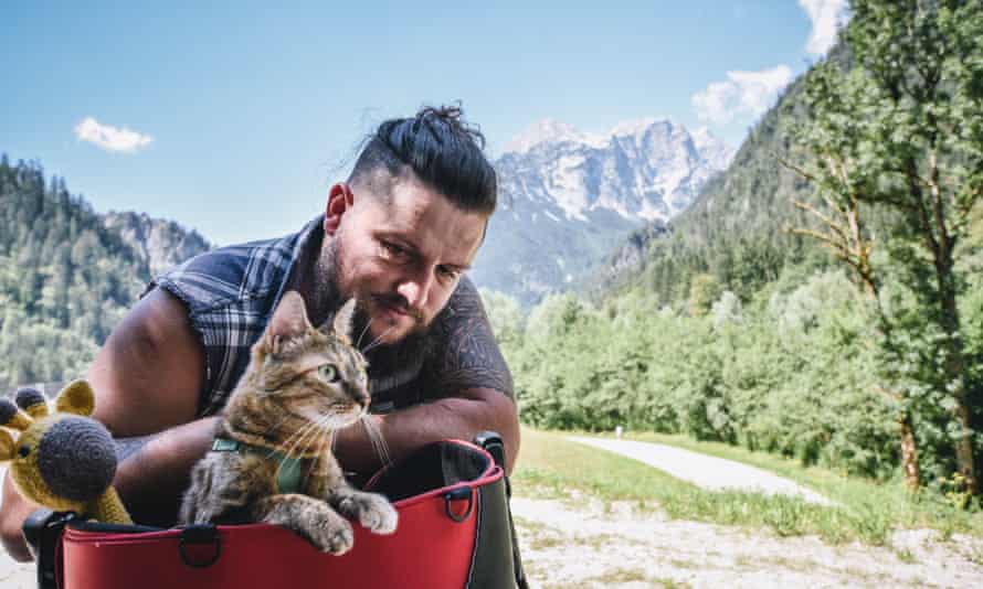 man travelling with cat nala