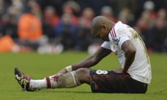 Manchester United’s Ashley Young sits on the pitch at Liverpool after sustaining his groin injury