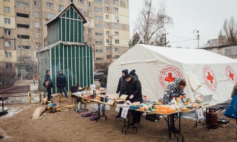 Red Cross and UNHCR representatives distribute food, heating and humanitarian aid to the victims in Dnipro.