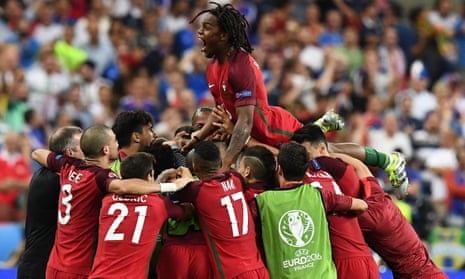 Portugal’s Renato Sanches jumps on teammates after Eder scores.