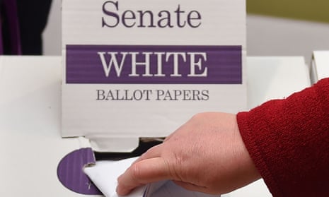 A woman casts her vote for members of the senate in the Australian Federal Election in Melbourne on 2 July 2016.