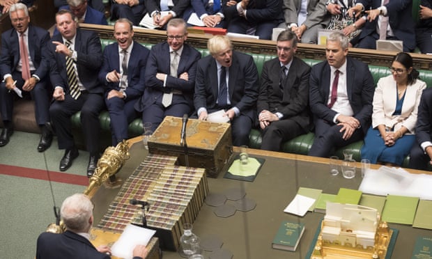 Boris Johnson, with his front bench MPs, face Jeremy Corbyn in the House of Commons