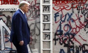 President Donald Trump walks from the White House through Lafayette Park to visit St John’s church in Washington on Monday.