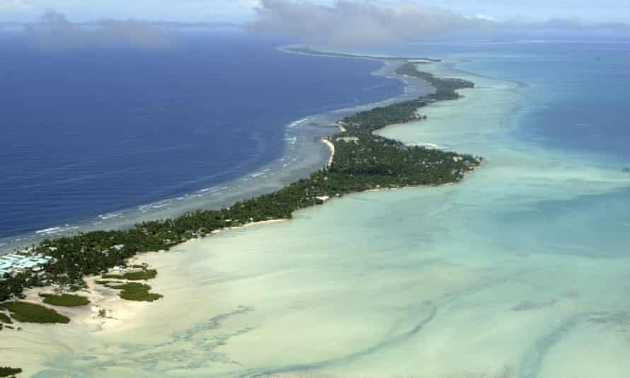 Rising sea levels caused by global warming threaten the very existence of the tiny Pacific nation of Kiribati, one of the lowest countries on the planet.