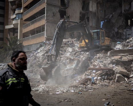 A bulldozer clears rubble from a building destroyed in Beirut, Lebanon, a day earlier.