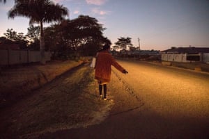 Sandra Chikore hitchhiking early in the morning in Harare