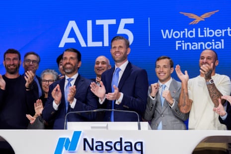 Donald Trump Jr and Eric Trump applaud with others at Nasdaq's opening bell event