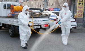 Members of the Seongbuk-gu Saemaul Leaders’ Council spray disinfectant as a precaution against the spread of coronavirus, on a street in Seoul, South Korea, 24 September 2020.