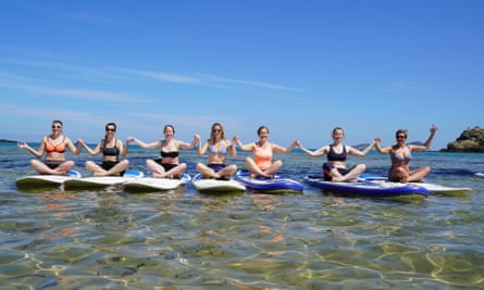 SUP yoga classes take place in the sea