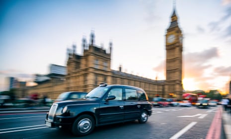 A black cab on Westminster Bridge in London.