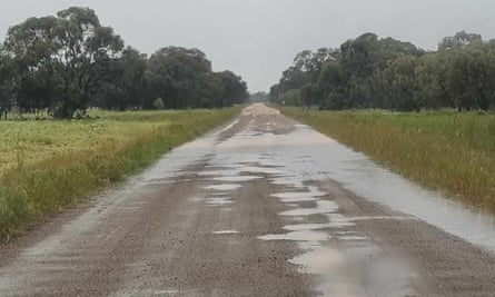 Flooding on Four Corners Road near Coleamnally, NSW in October. The dirt road is riddled with potholes and becomes unsafe for school buses after rain.