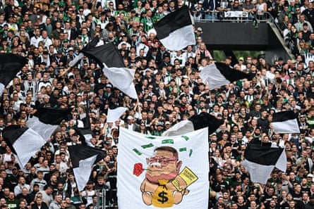 Mönchengladbach fans with a banner depicting Max Eberl