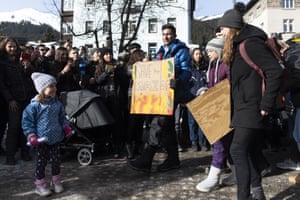Swedish climate activist Greta Thunberg, second right, arrives for a “Fridays for Future” demo on the final day of the 50th annual meeting of the World Economic Forum, WEF, in Davos, Switzerland, Friday, Jan. 24, 2020. (Gian Ehrenzeller/Keystone via AP)