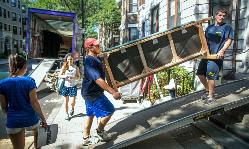Movers help students move in to a dorm in Boston