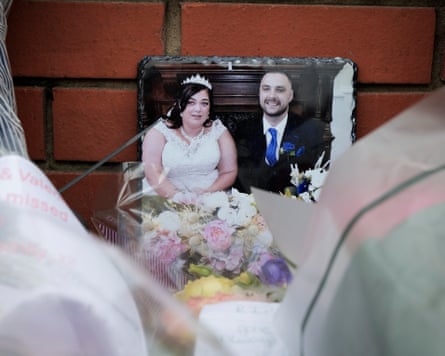 A picture of a couple of their wedding day place at the seen of a fatal house fire.